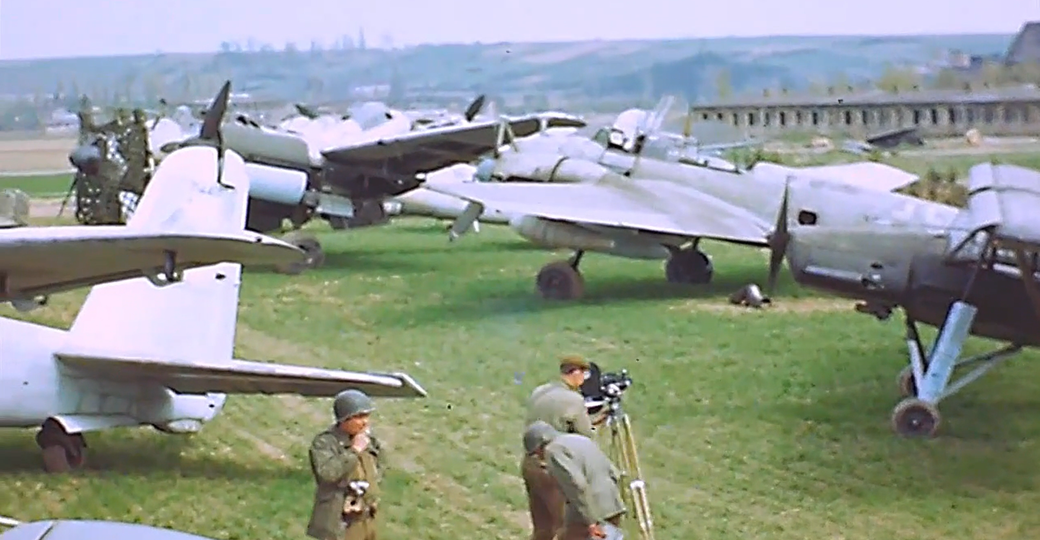 A frame from a colour video shot by United States Army personnel at Fritzlar, in spring 1945. In the upper left corner a late war Ju 88 is visible, with its dark green prefabricated engine cowling. If Ta 152 H W.Nr. 150168 engine cowling had been actually painted with the same paint, the hue here shown would have been the one appeared on "Green 9".